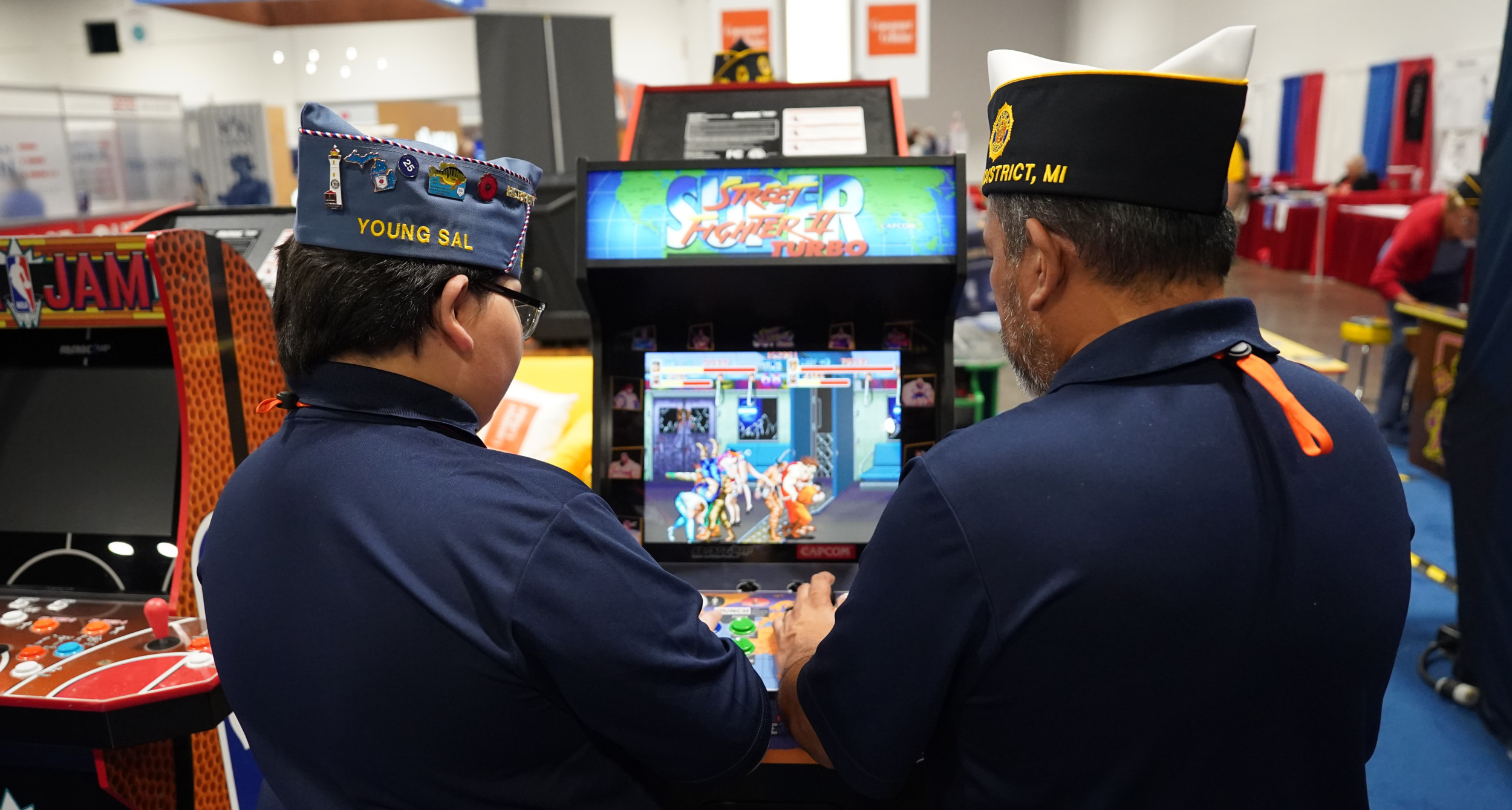 Legion Family members play a game of Street Fighter at the American Legion Gaming Lounge during National Convention in 2025.